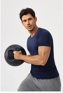 Detail of high-elastic men's gym t-shirt in navy blue during fitness training