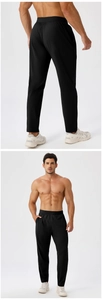 Detail view of men's quick-dry sports pants featuring elastic waistband and side pockets