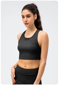 Close-up of black ribbed yoga crop top showing high-elasticity fabric and slim fit design