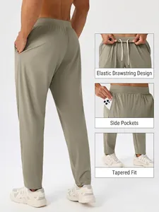 Men's quick-dry sports trousers in sage green with elastic drawstring and tapered fit