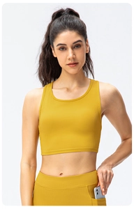 Close-up of ginger yellow ribbed yoga top and leggings with functional phone pocket