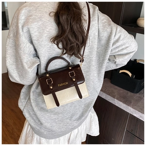 British retro crossbody bag with contrast colors and fashion lettering on female model