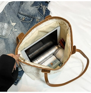 Spacious tote bag interior showing capacity for tablets and daily skincare products