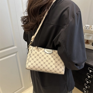 Chic beige faux leather crossbody bag with floral geometric pattern and gold hardware