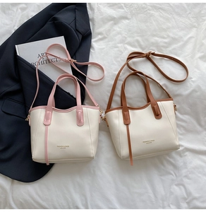 Top view of minimalist color-block tote bags in pink and brown with long shoulder straps