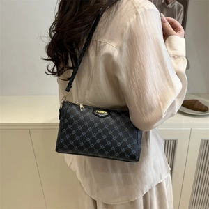 Chic black PU leather crossbody bag with all-over logo print and gold fashion plaque
