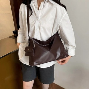 Retro large capacity coffee tote bag with mini coin purse shown on a shoulder model