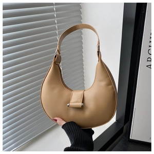 Detailed close-up of a khaki crescent moon hobo bag with silver buckle and smooth PU leather