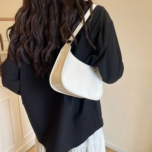 Glossy white patent leather crescent underarm bag with gold hardware for women