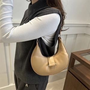 Minimalist beige crescent hobo shoulder bag in smooth faux leather for daily commuting