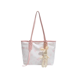 Minimalist white tote bag with pink butterfly prints and a cute rabbit plush pendant
