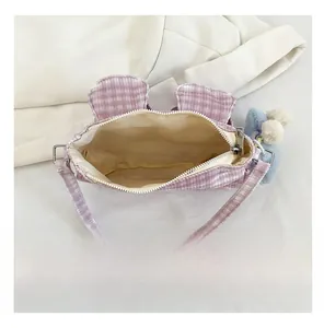 Internal structure of purple plaid corduroy shoulder bag with zipper and plush ball