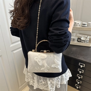 Elegant off-white evening bag with butterfly embroidery and pearl buckle strap