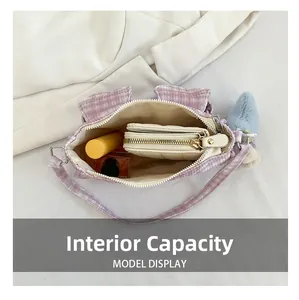 Internal capacity of lavender corduroy bag with rabbit ears showing storage space