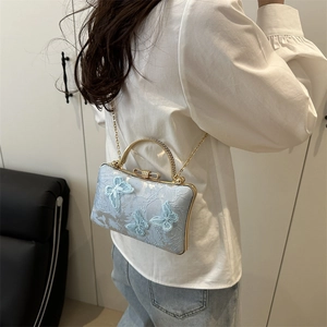 Elegant light blue embroidered butterfly crossbody bag with gold chain and metal handle