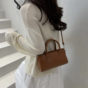 Brown leather large capacity shoulder bag with top handles and adjustable strap