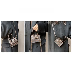 Detail view of mini leopard print crossbody bag showing handheld and shoulder carrying styles