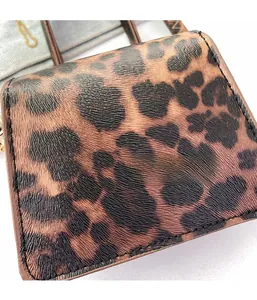 Macro shot of faux leather leopard print texture with pebble grain and soft fabric detail