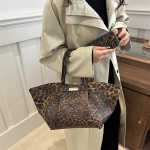 Stylish large leopard print tote bag with matching phone case and gold plaque detail