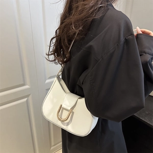 White leather dumpling underarm bag with gold U-shaped buckle for commuting fashion
