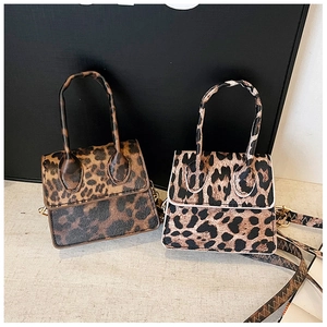 Side-by-side view of small leopard print handbags in brown and white tones