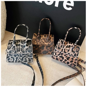 Three leopard print mini handbags in grey, coffee and brown colors with top handles