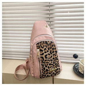 Pink leopard print crossbody bag detail with golden zippers and double compartments