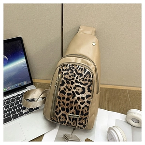 Detailed view of leopard print crossbody bag with beige PU leather and metal zipper