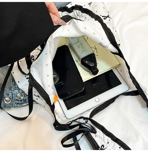 Internal view of the floral tote bag showing large capacity for tablets and cosmetics