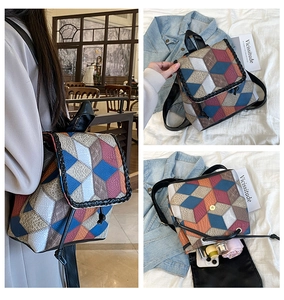 Detailed view of women's crossbody bag with 3D colorful geometric embossed patchwork texture