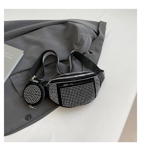 Detail of black crossbody chest bag with shiny silver rhinestones and wide strap