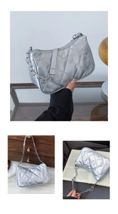 Close-up of quilted silver hobo bag with metallic finish and adjustable chain strap