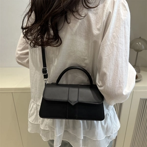 Chic black square flap shoulder bag for women with minimalist top handle and crossbody strap