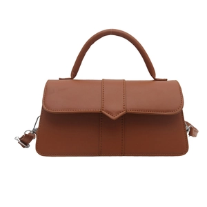 Minimalist vintage brown leather square bag with top handle and crossbody strap in caramel