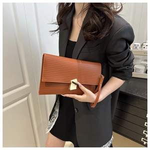 Caramel brown water ripple leather envelope clutch bag with gold geometric metal clasp