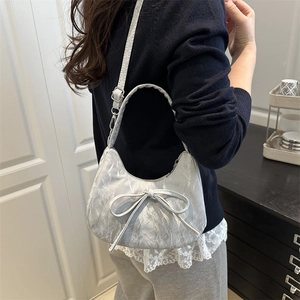 Silver bow-accented hobo shoulder bag with pleated reflective texture for women