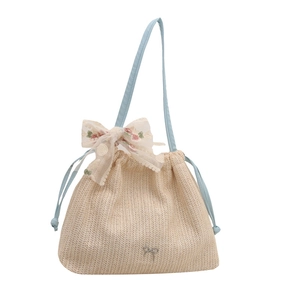 Straw beach tote bag with light blue straps and large floral lace bow detailing