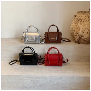 Detailed view of mini square crossbody bags in silver, brown, black and red colors