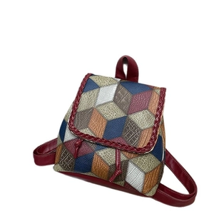 Multicolor patchwork faux leather shoulder bag with crossbody strap and woven details