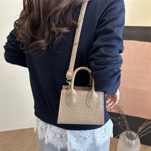 Retro beige woven handbag for women featuring top handles and adjustable shoulder strap