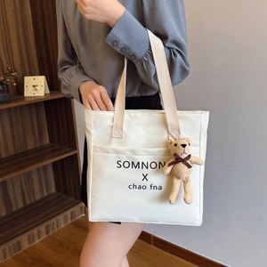 Large capacity cream canvas tote bag with letter print and teddy bear charm for women