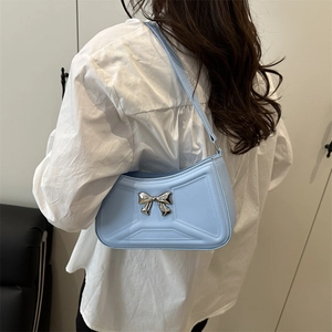 French style light blue underarm bag with bow detail and geometric embossed texture