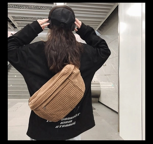Brown corduroy crossbody bag with dual zippers shown in a stylish back view style