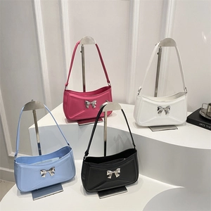 French style shoulder bags with bow metal decor and geometric embossing in four colors