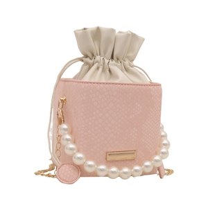 Pink snakeskin bucket bag with pearl handle, drawstring closure, and gold chain strap