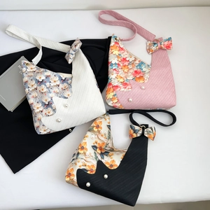 Chic floral patchwork tote bag with cat silhouette and pearl bow detailing