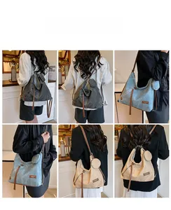 Detail of versatile canvas tote showing multi-way straps and detachable round coin pouch