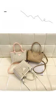 Detailed view of woven straw bucket bags with leather handles and metal logo plaques