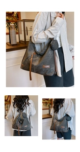 Detail of grey canvas tote bag with leather zip pull and detachable mini round coin purse