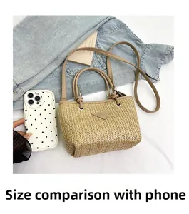 Size comparison of a summer woven bucket bag with phone case on denim background